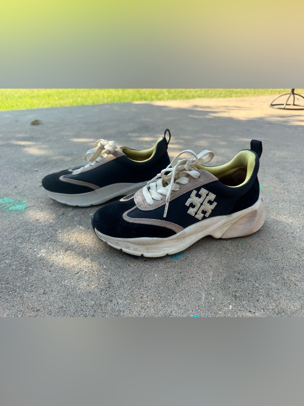 Tory Burch. Black Cream sneakers,tennis shoes, Size 7.5 great condition.